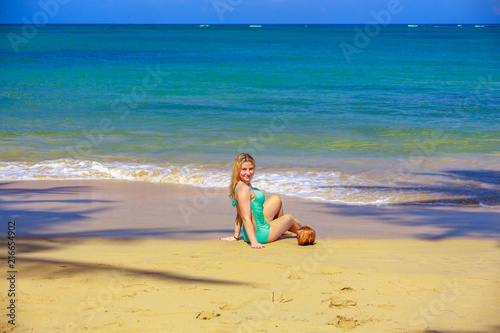 Girl with coco on the beach