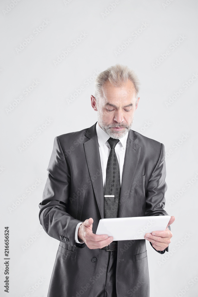 modern businessman with digital tablet.isolated on grey background modern businessman with digital tablet.isolated on grey background