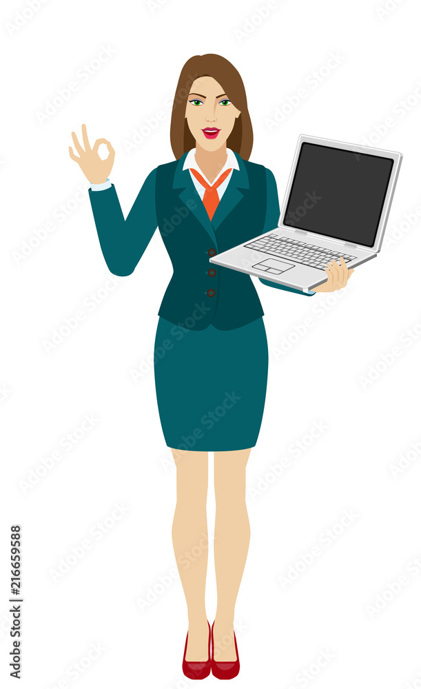 Businesswoman holding a laptop notebook and show a okay hand sign Businesswoman holding a laptop notebook and show a okay hand sign