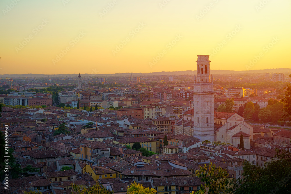 Top angle view of Verona, Italy at summer sunset, sun lens flare