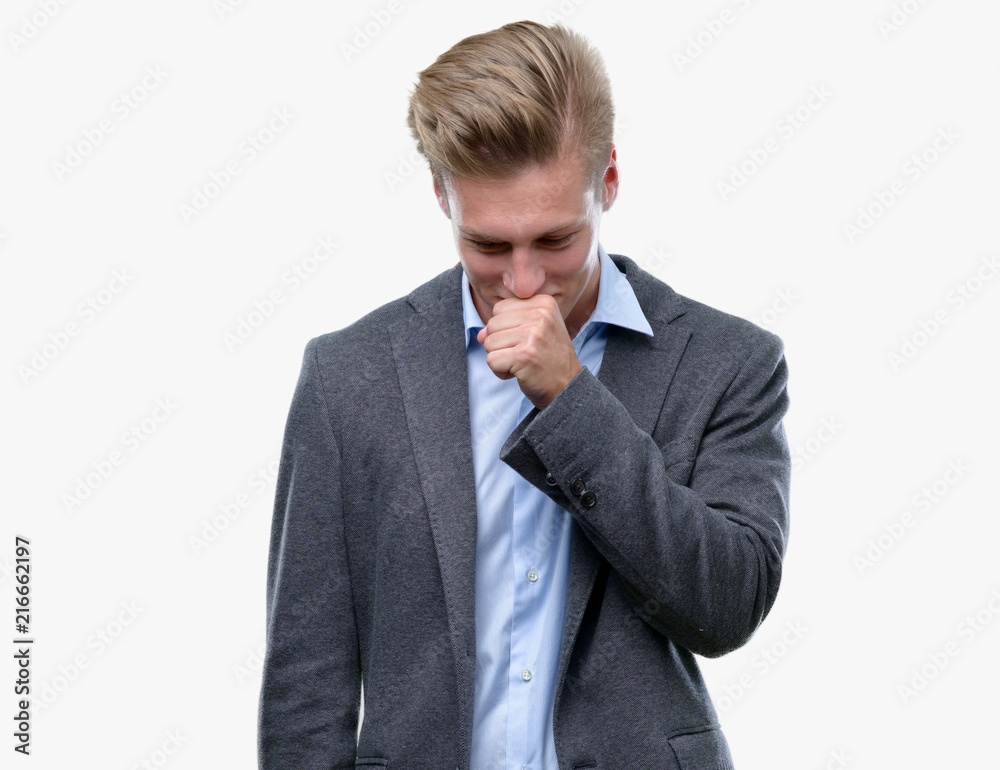 Young handsome blond business man feeling unwell and coughing as symptom for cold or bronchitis. Healthcare concept. Young handsome blond business man feeling unwell and coughing as symptom for cold or bronchitis. Healthcare concept.