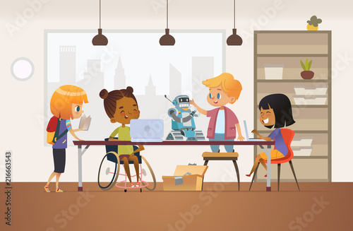 Disabled African American girl in wheelchair and other children standing around desk with laptops and robot and working on school project for programming lesson. Concept of inclusion at school.