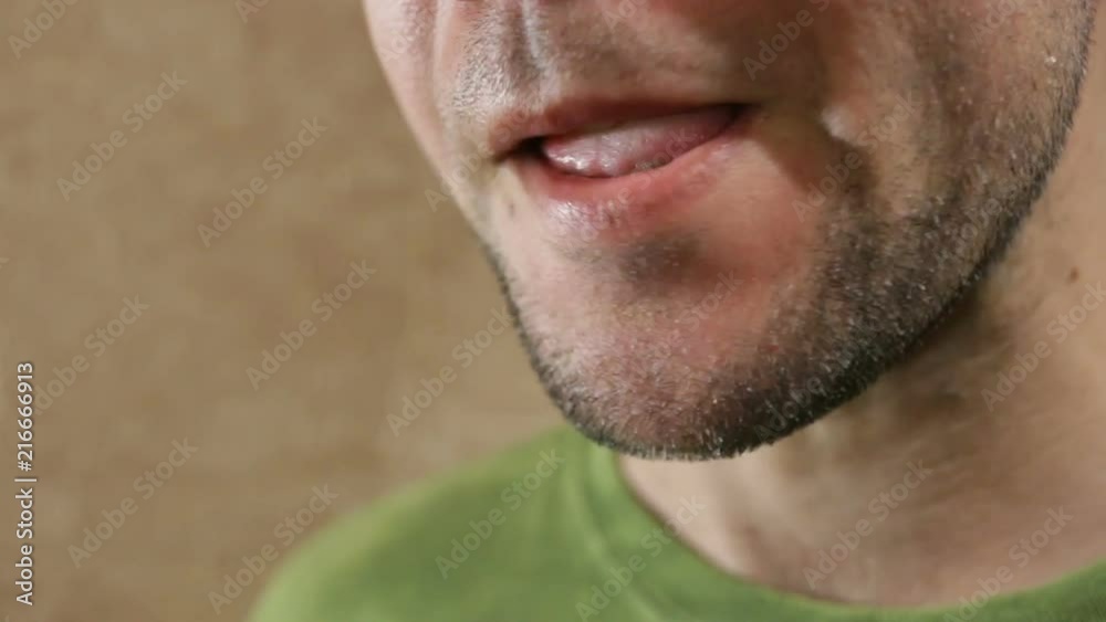 Unshaven white man drinks a glass of wheat beer. Close-up, real time, indoors. Unshaven white man drinks a glass of wheat beer. Close-up, real time, indoors.