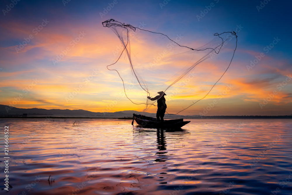 Silhouette of Myanmar fisherman on wooden boat ,Myanmar fisherman