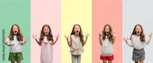 Collage of brunette hispanic girl wearing different outfits crazy and mad shouting and yelling with aggressive expression and arms raised. Frustration concept. photo