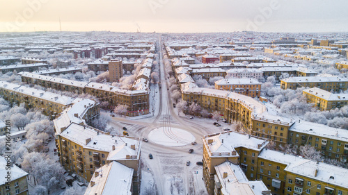 Drone photo of Magnitogorsk city in the winter evening, building of the fifties, Russia
