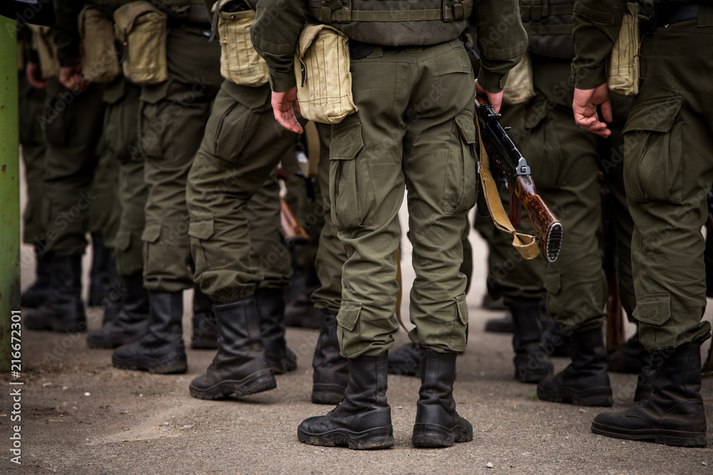 A Kalashnikov rifle in the hands of the military. War in Ukraine. Anti-terrorist operation in Ukraine. ATO in Ukraine. Armed forces. A Kalashnikov rifle in the hands of the military. War in Ukraine. Anti-terrorist operation in Ukraine. ATO in Ukraine. Armed forces.