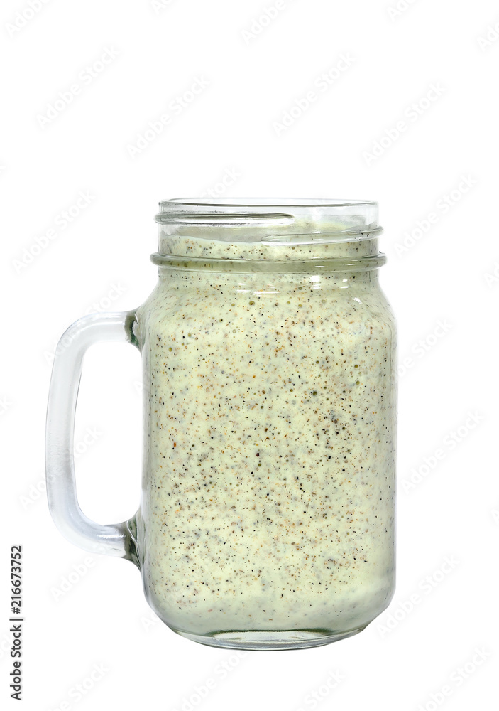 Energy smoothie in a mason jar with white background. Energy smoothie in a mason jar with white background.
