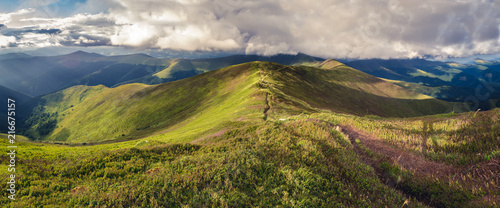 Panorama of Borzhava ridge of the Ukrainian Carpathian Mountains. Mount Velykyi Verch is at the background. Clouds above Carpathian Mountains.