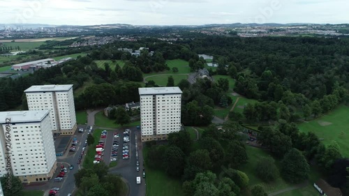 Aerial footage over high rise flats and Callendar Park in Falkirk, Scotland.