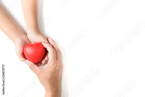 Father give red heart to his daughter isolated