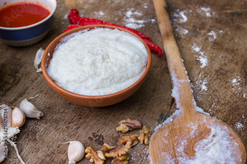 Gomi (mamaliga porridge) - popular dish from Samegrelo region made of white coarse cornmeal, butter and salt. Georgian traditional food. photo