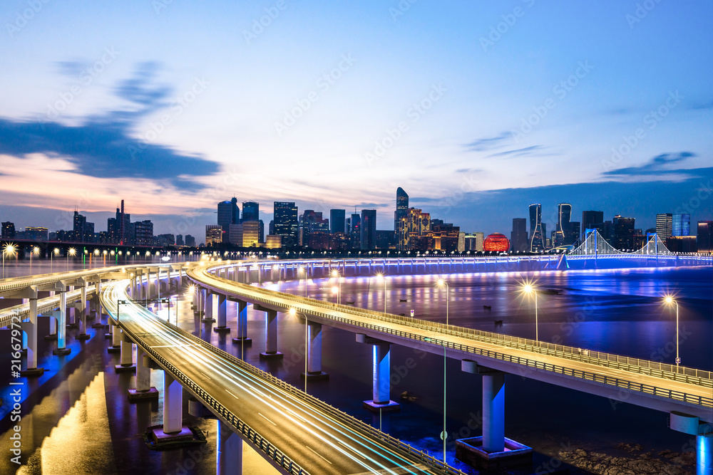 Fototapeta premium empty asphalt road with city skyline