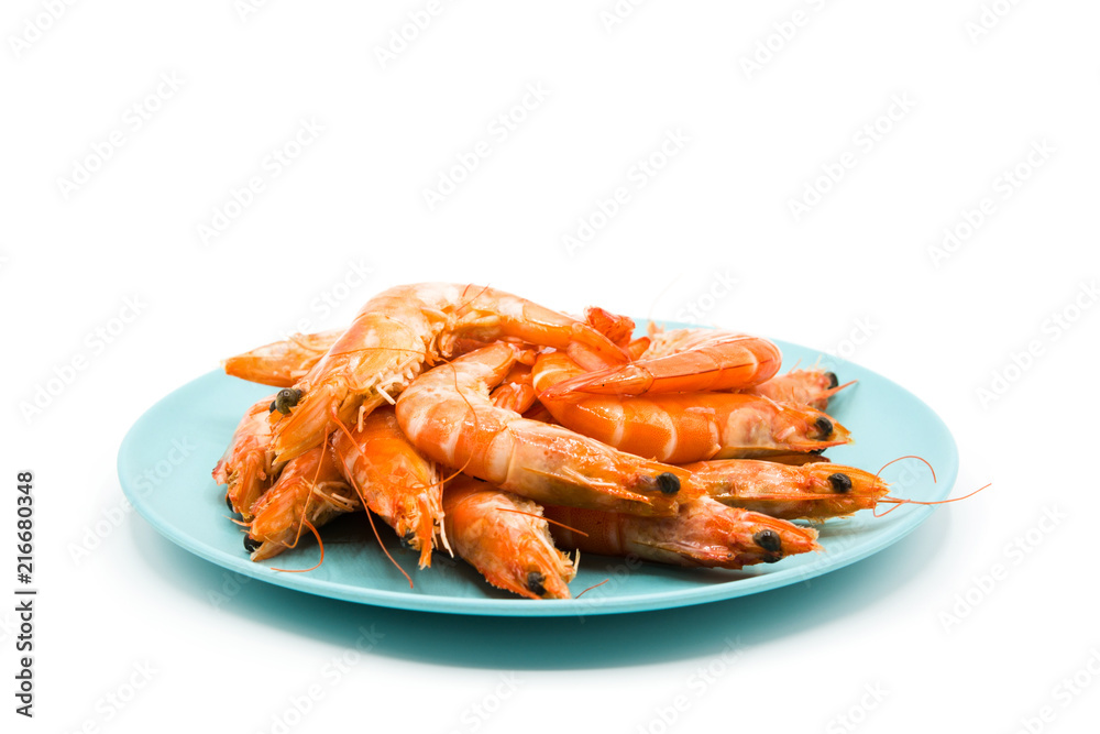 Grilled shrimps on blue plate isolated on white background
Grilled shrimps on blue plate isolated on white background