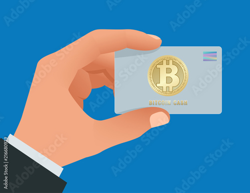A man s hand holds a Bitcoin debit card. Account, credit, all in one card concept for bitcoin. Paying by Bitcoin to pay a bill. Digital currency money. Technology credit card bitcoin mining worldwide.