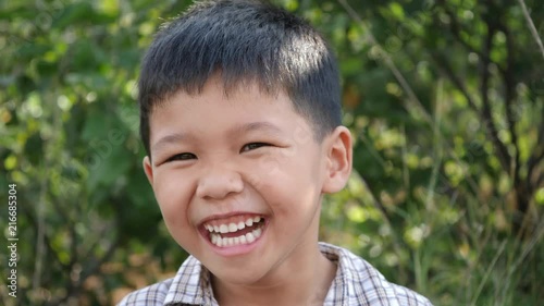 Close up little boy laughing and smile after hearing joke story