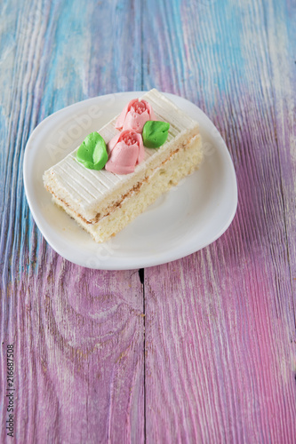 Tasty mini cake on a color ...