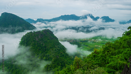 Landscape of mountains and clouds Green tree in the rainy season