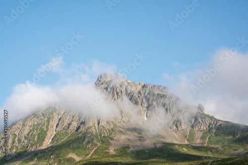 High big mountain and meadows in the Kackar Mountains. . Beautiful blue sky,grasses and clouds. photo
