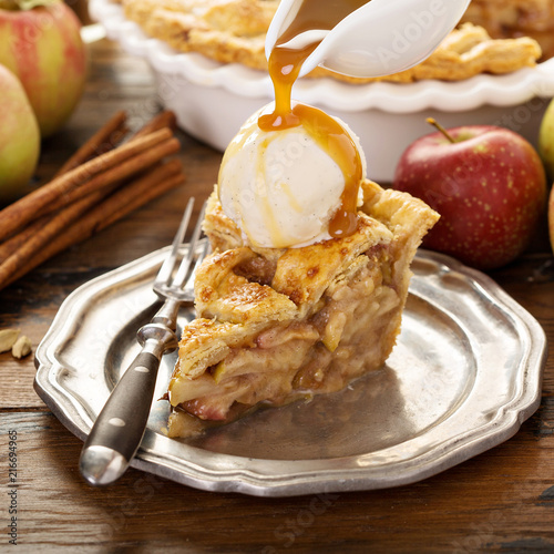 Homemade apple pie slice with vanilla ice cream photo