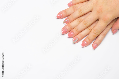 Female soft hands with beautiful french manicure. isolated white background. long nails. place for text. copy space