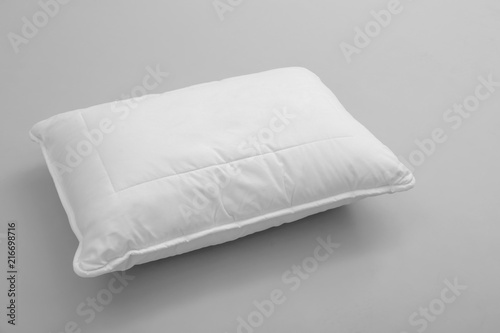 Fototapeta Naklejka Na Ścianę i Meble -  Clean soft bed pillow on grey background