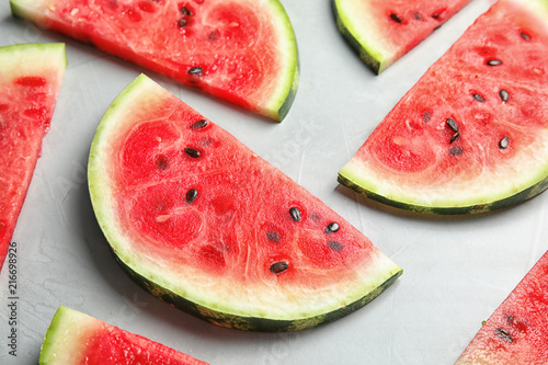 Fresh juicy watermelon slices on grey background