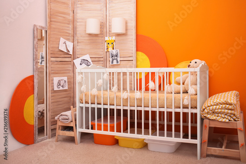 Fototapeta Naklejka Na Ścianę i Meble -  Baby room interior with crib near color wall