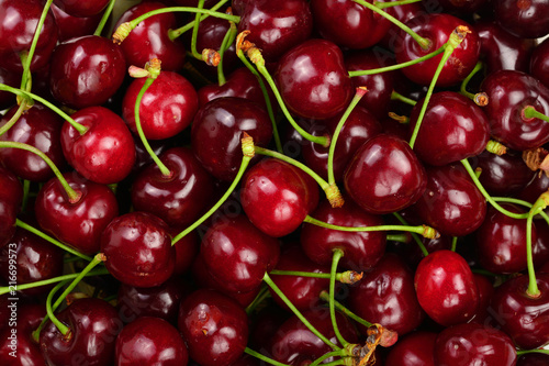 Background of ripe red cherries. Healthy eating. The texture of berries