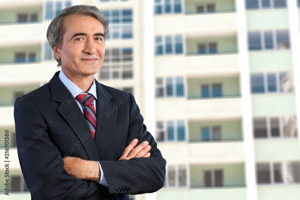 Mature confident Businessman on background Mature confident Businessman on background