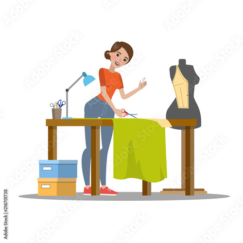 Female dressmaker cutting cloth