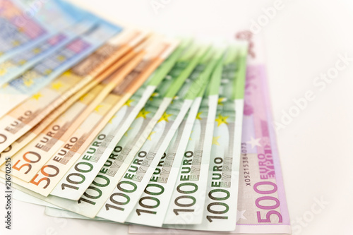 Spread Stack of Euro Banknotes, isolated close-up on white background