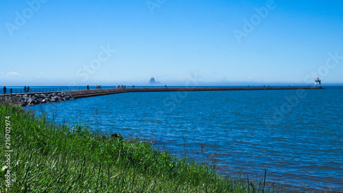 People on jetty at Two Harbors  Minnesota on a sunny day