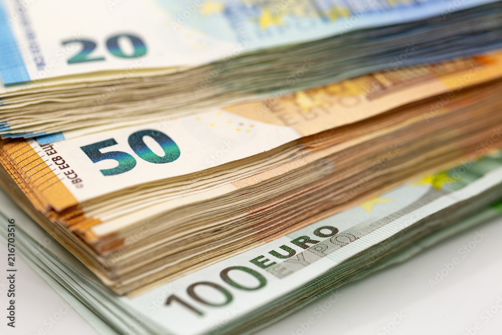 Pile of Euro Banknotes, isolated close-up on white background Pile of Euro Banknotes, isolated close-up on white background