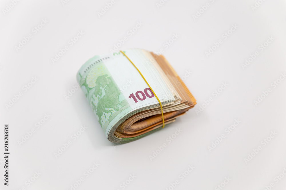 Euro Banknotes in a roll, isolated close-up on white background Euro Banknotes in a roll, isolated close-up on white background