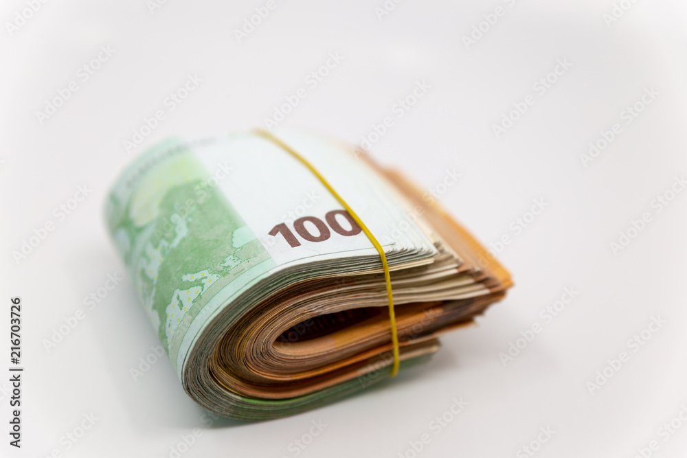 Euro Banknotes in a roll, isolated close-up on white background Euro Banknotes in a roll, isolated close-up on white background