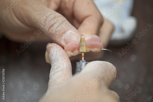 Dental technician make denture prothesis in dental laboratory