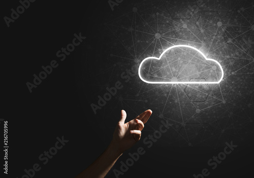 Digital cloud icon as symbol of wireless connection on dark background