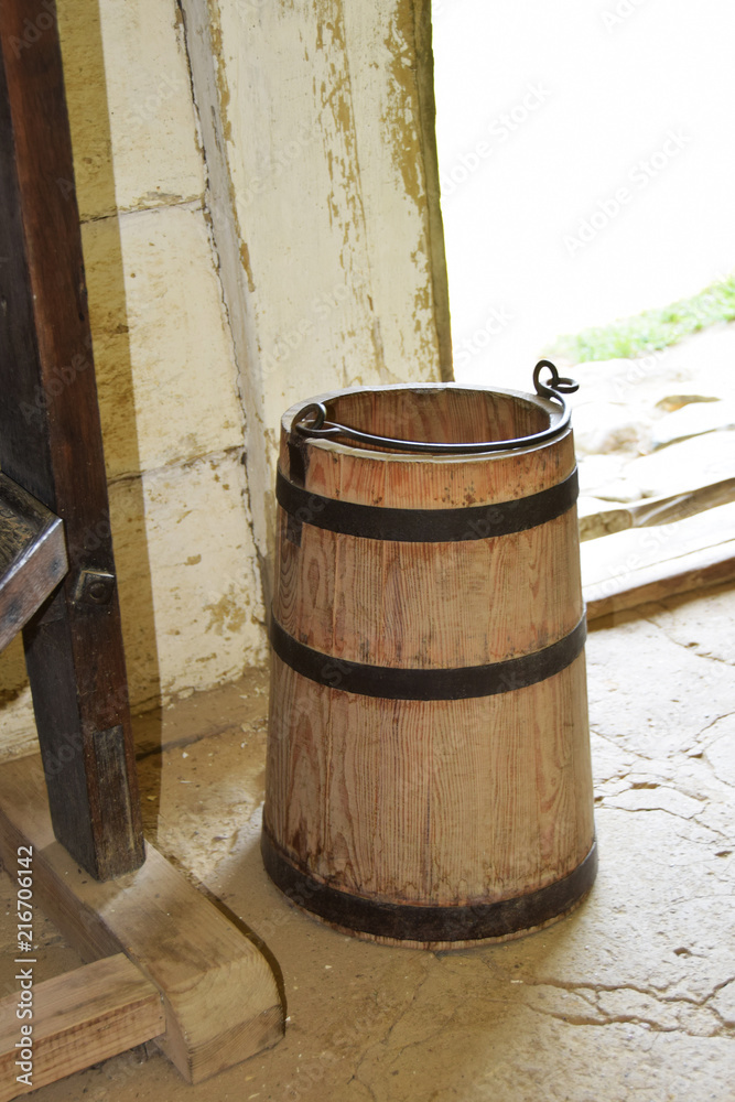 wooden buckets and barrels from the Middle Ages for storing and carrying food wooden buckets and barrels from the Middle Ages for storing and carrying food