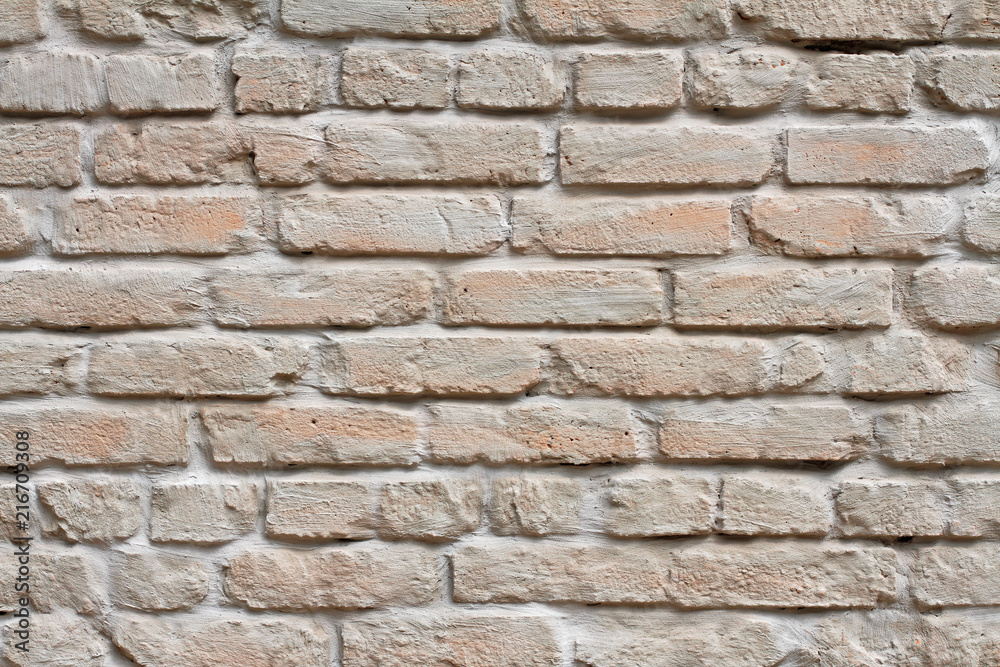 Brick wall painted in pastel color as background, texture