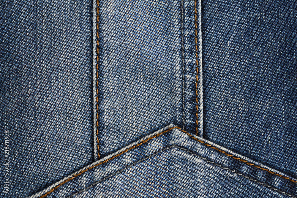Neat stitching on the pocket of blue denim jeans Neat stitching on the pocket of blue denim jeans