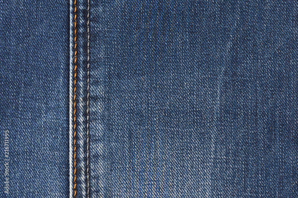 Neat stitching on the pocket of blue denim jeans Neat stitching on the pocket of blue denim jeans