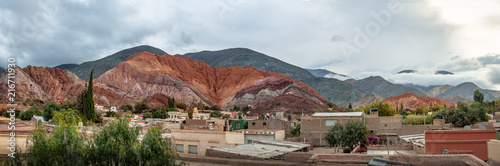 Panoramic view of Purmamarca town with the Hill of Seven Colors (Cerro de los siete colores) on background - Purmamarca, Jujuy, Argentina
