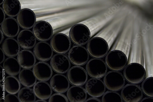 Lot of industrial metal steel pipes tubes for production for heating or engineering industry processing cutting welding and other work