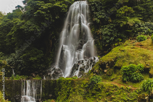 Beautiful natural waterfall deep inside the islands of Azores, Portugal. Green grass and crystal clear water. #3