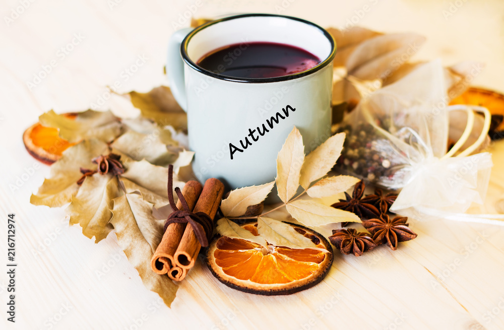 Autumn, fall leaves, hot steaming cup of glint wine Autumn, fall leaves, hot steaming cup of glint wine