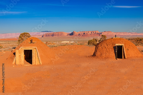 Mud Baked Navajo Homes Called Hogans in Monument Valley, Arizona, USA photo