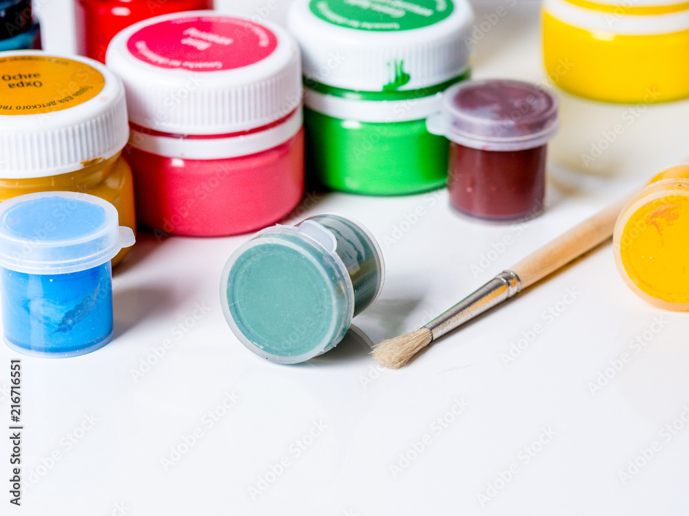 Old used watercolor paint box on a white background Old used watercolor paint box on a white background