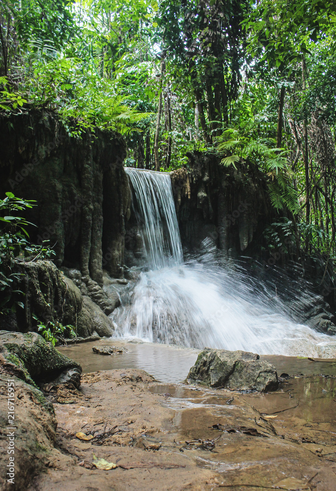 Obraz premium Waterfall in Erawan Falls, located in tropical forest at Erawan National Park, in Kanchanaburi province, Thailand.