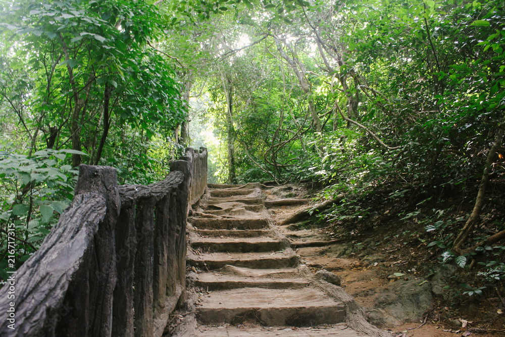 Crude stairs and wooden railings leading to next tier at Erawan Falls, in Kanchanaburi province, Thailand. Crude stairs and wooden railings leading to next tier at Erawan Falls, in Kanchanaburi province, Thailand.